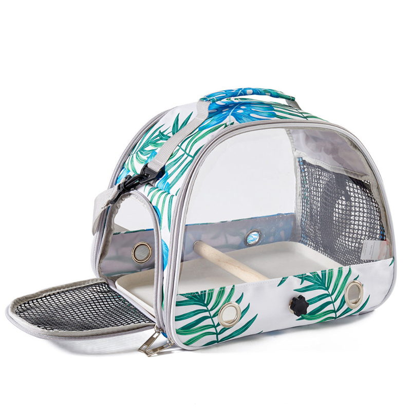 Pet carrier with tropical leaf design on a white background
