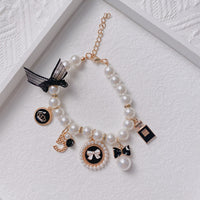 Thumbnail for Black 4-PCS Pearl Charm Pet Necklace - Adjustable Bowknot Collar for Small Dogs & Cats (M: 25+5CM)